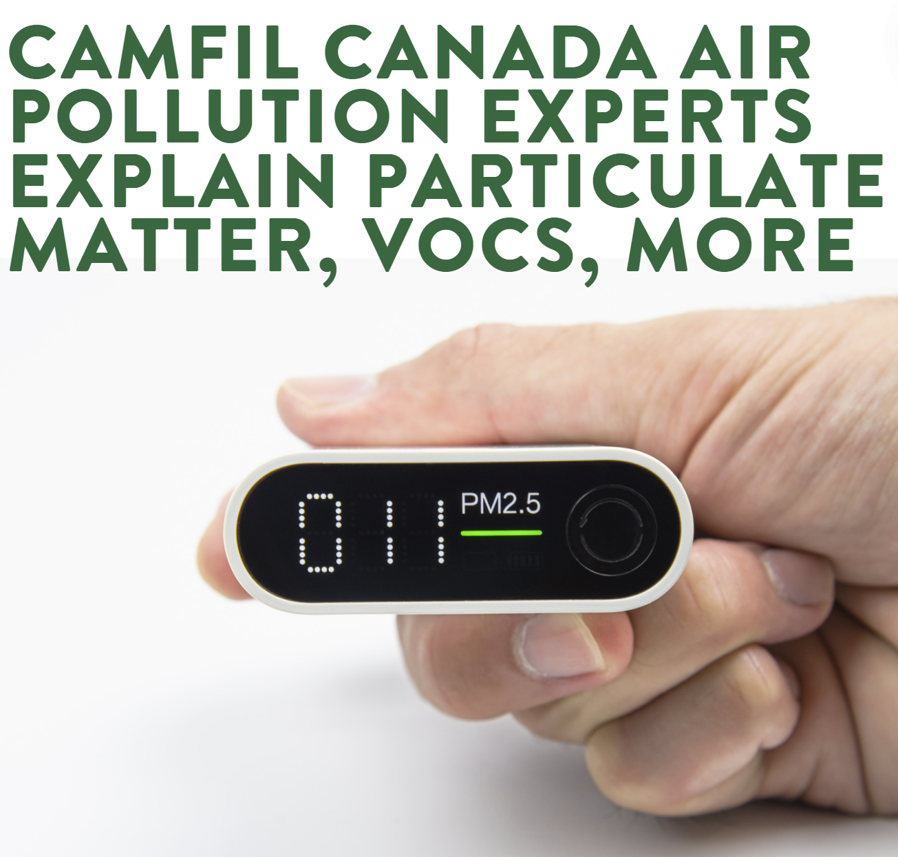 A hand holds a meter that shows 011 and PM2.5